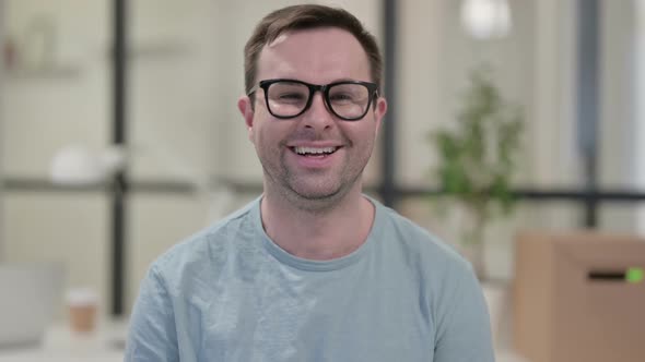 Portrait of Young Man Smiling at Camera