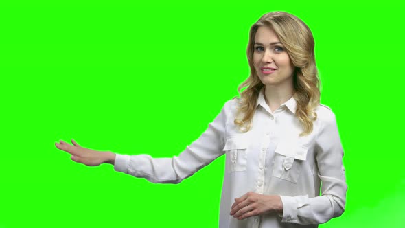 Young Charming Woman Presenting Something on Green Screen