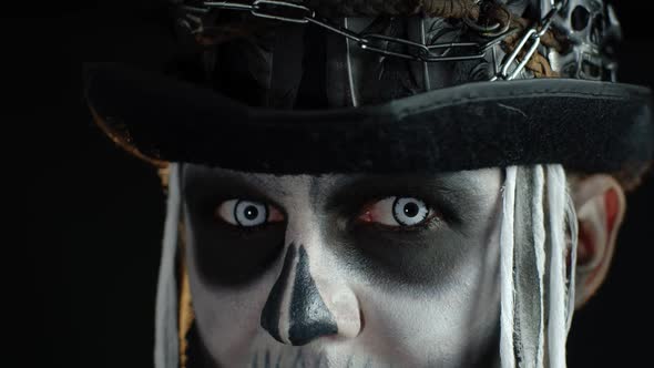 Close-up of Scary Man Face in Carnival Skull Halloween Makeup of Skeleton Looking Creepy at Camera