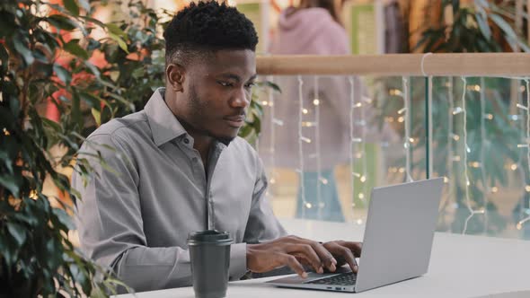 Focused Young Male Freelancer Working Online Typing on Laptop Happy Guy Student Successful