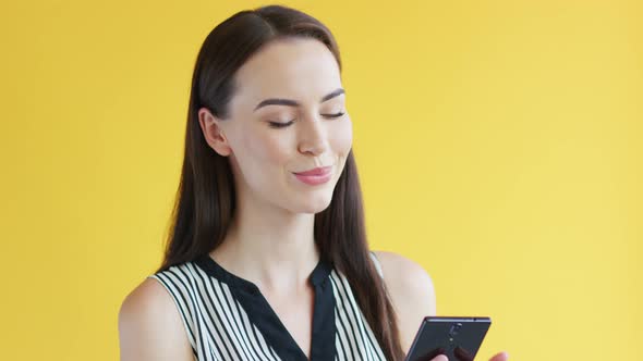 Gorgeous Female Using Smartphone