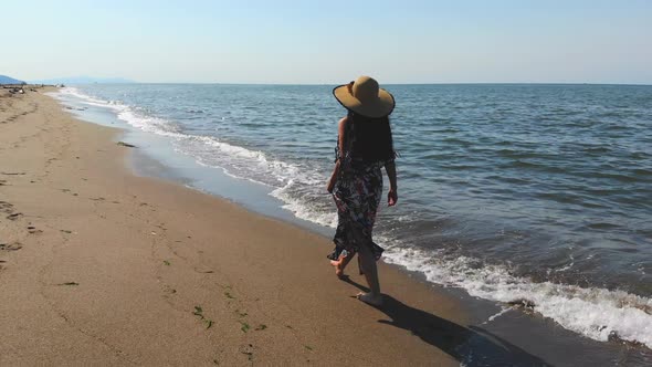 Girl Walking at the Seaside