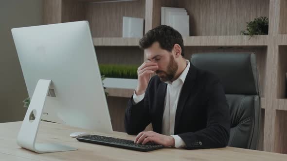 Close Up of an Executive or an Office Worker Closing His Eyes From the Tiredness