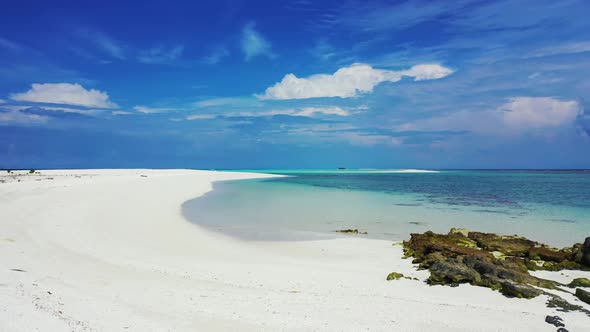 Aerial flying over seascape of marine bay beach adventure by turquoise lagoon with white sand backgr