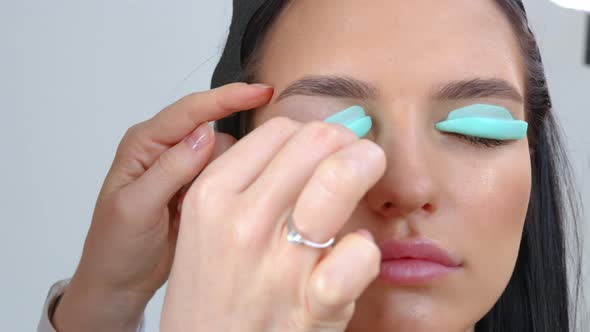 Face of a Young Girl in a Modern Eyelash Lamination Procedure in a Professional Beauty Salon