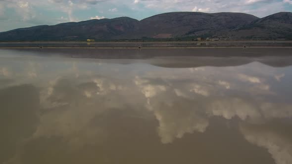 Alykes the Hellenic saltworks located outside of Mesolongi in Greece. Drone footage with the clouds