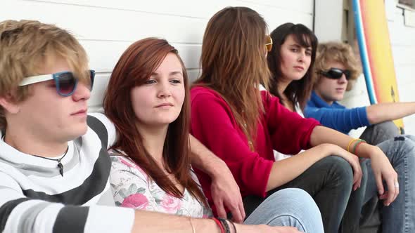 Young friends sitting together