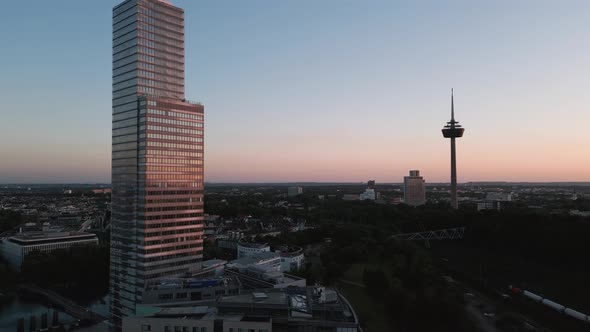 Cologne, Germany - Ascending flight bird view of an business media park and skyscrapers with a panor