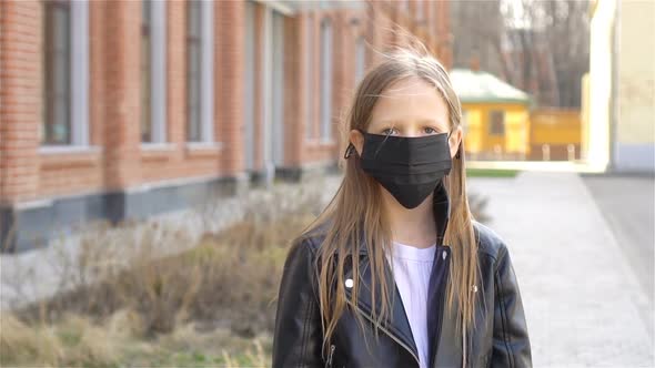 Girl Wearing a Mask Protect Against Coronavirus and Gripp
