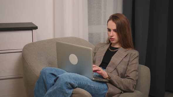 Tired Upset Young Woman Using Laptop Looking at Screen Typing Message Woman Chatting on Laptop