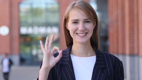 Okay Sign By Satisfied Business Woman