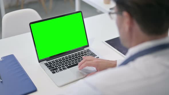 Doctor using Laptop with Green Chroma Screen