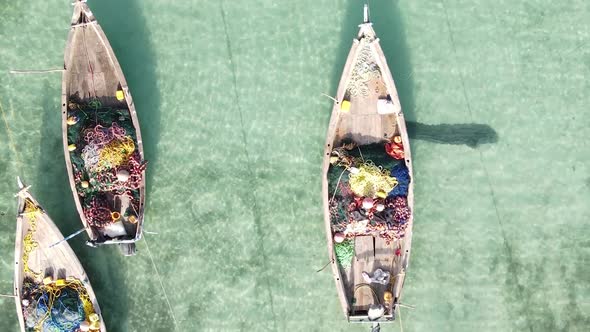 Vertical Video Boats in the Ocean Near the Coast of Zanzibar Tanzania Aerial View