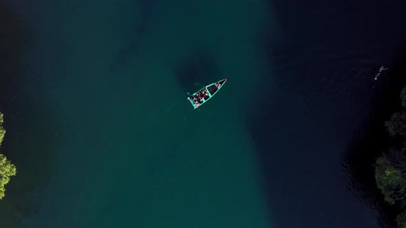 AERIAL: Lago De Camecuaro, Boat, Swimmer, Tangancicuaro, Mexico (Ascending Down)