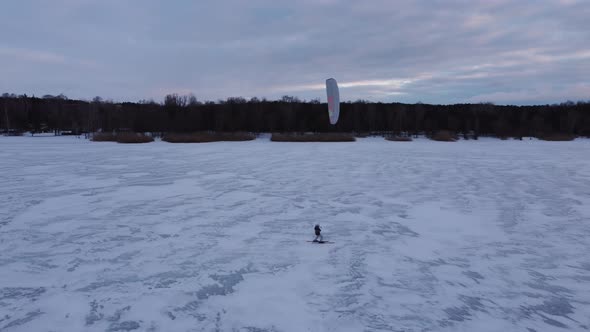 SnowKiting Kitesurfing Sport on the Ice Lake Winter