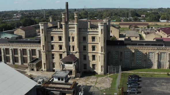 Aerial view of the derelict and abandoned Joliet prison or jail, a historic place. Drone rotating ar