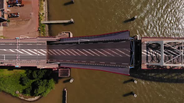 Top-down View Of Single-leaf Bascule Bridge Opening For Passage Of Watercraft Vessels In Alblasserda