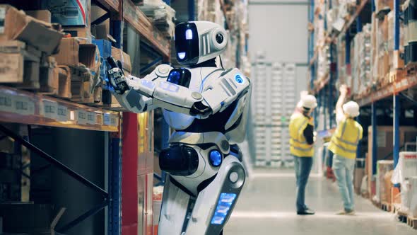 Closeup of Warehouse Robot Taking Inventory of Goods