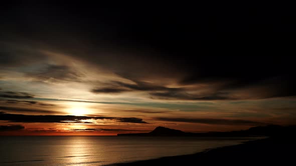 Clouds Moving Over Sea At Sunrise, Timelapse