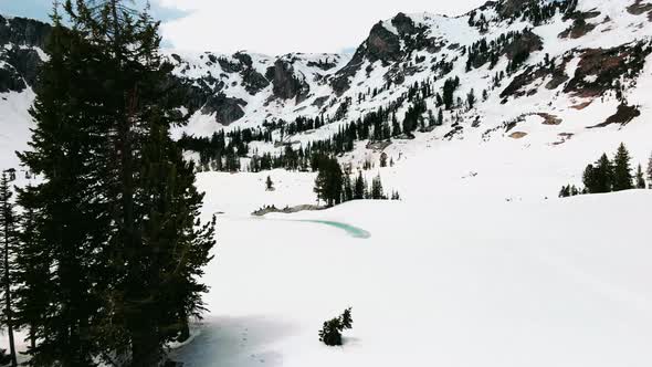 group of people hiking on harsh condition through mountains