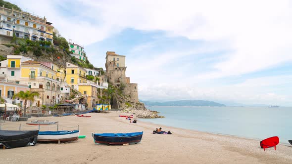 Cetara, Italy. Time lapse video of the beach and old buildings and tower near the sea.