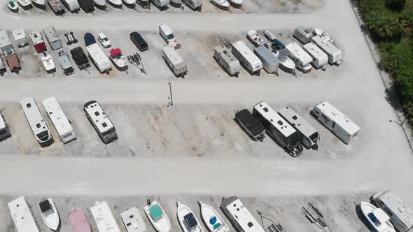 Very slow drone hover over recreational vehicle storage lot in South Florida.  RV trailers, motorhom