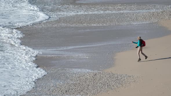 Photographer Waves On Sand