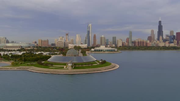 Aerial of Adler planetarium and Chicago skyline