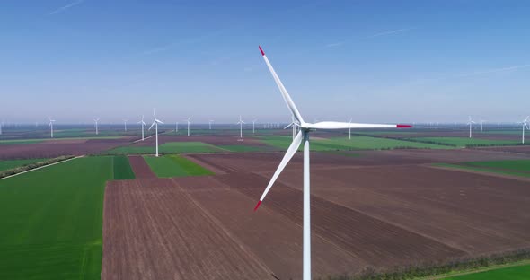 Aerial view of a wind turbine. Windmill for electric power production. Green energy.