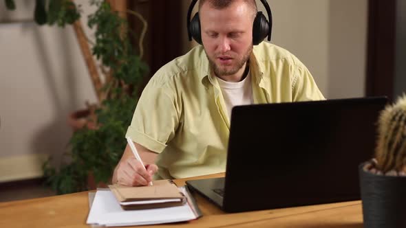 Man Wearing Wireless Headphones Watch Webinar Trainning