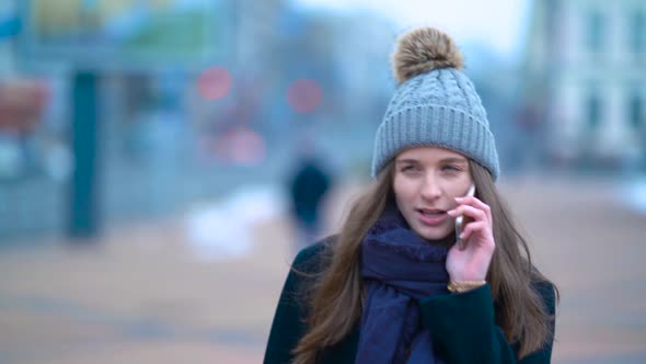 Girl With Phone On Street