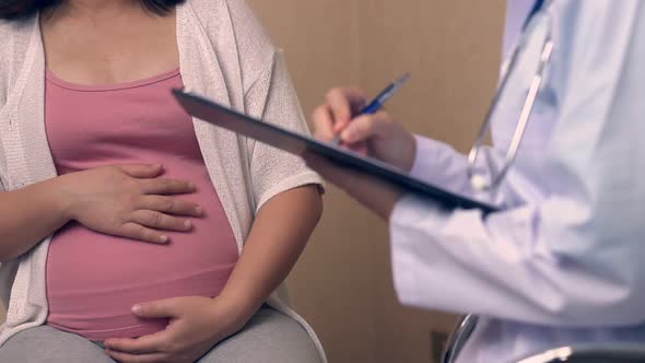 Pregnant Woman and Gynecologist Doctor at Hospital