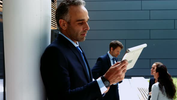 Businessman using digital tablet in office