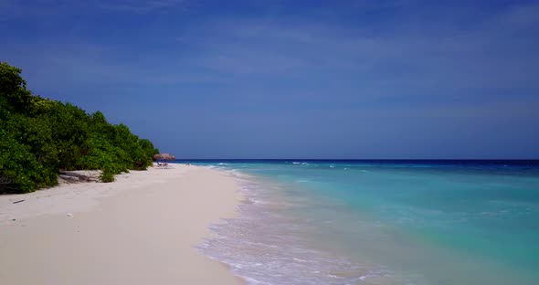 Daytime drone island view of a sandy white paradise beach and aqua blue water background in hi res 4