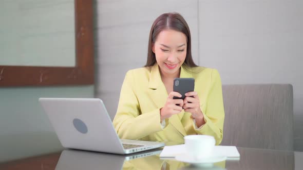 Young asian woman use smart phone