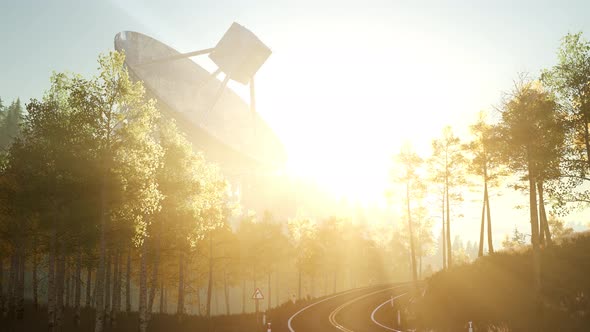 The Observatory Radio Telescope in Forest at Sunset