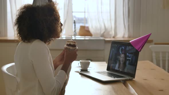 African Girl Conducts Online Birthday Party Blowing Candle