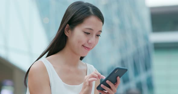 Woman Read on Smart Phone for Online