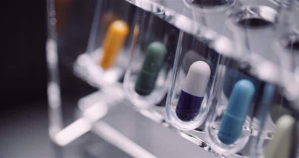 Test Tubes Filled with Pills and Drugs alt