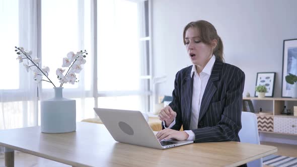 Young Woman Coughing at Work in Office Cough