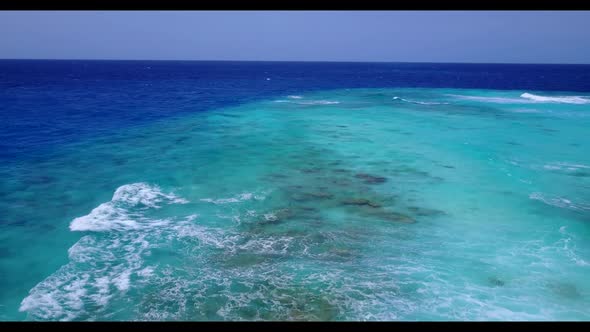 Aerial travel of idyllic lagoon beach break by shallow water and white sand background of a dayout n