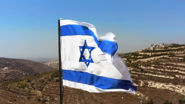 Israeli Flag on the Background of Judea and Samaria