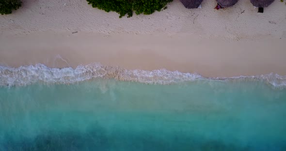 Luxury overhead abstract shot of a summer white paradise sand beach and aqua turquoise water 