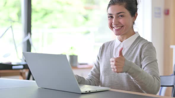 Positive Indian Businessman with Laptop Doing Thumbs Up