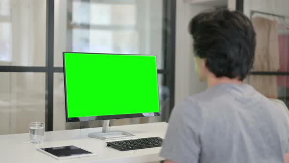 Video Call By Businessman on Desktop with Green Chroma Key Screen