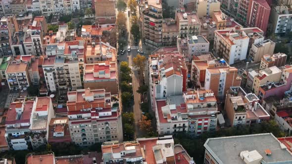 Aerial drone view of Barcelona, Spain. Blocks with multiple residential buildings, roads with cars