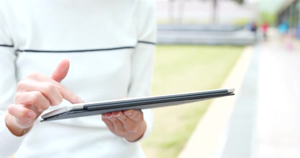 Woman use of tablet at outdoor