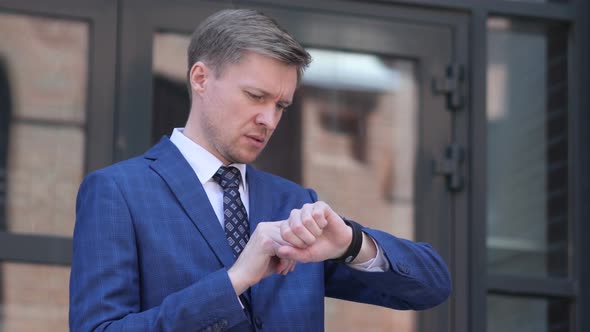 Businessman Using Smartwatch