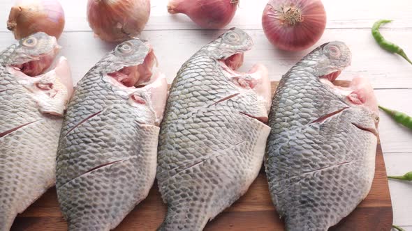 Raw Fresh Fish on a Chopping Board for Preparing for Cooking on Table 