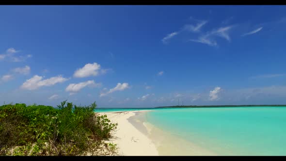 Aerial drone view travel of tranquil island beach vacation by blue ocean with bright sandy backgroun